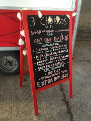 A photo of the Churros Bar sign showing what's on their menu