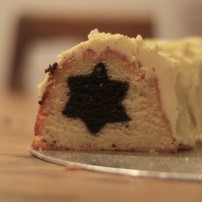 A close up photograph of the mint chocolate star cake in cross-section. The star runs through the middle of the entire bundt cake.