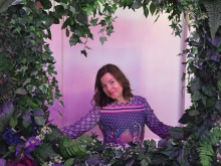 A photograph of Emma in a photo booth wearing a dress from Five Six Blue Boutique