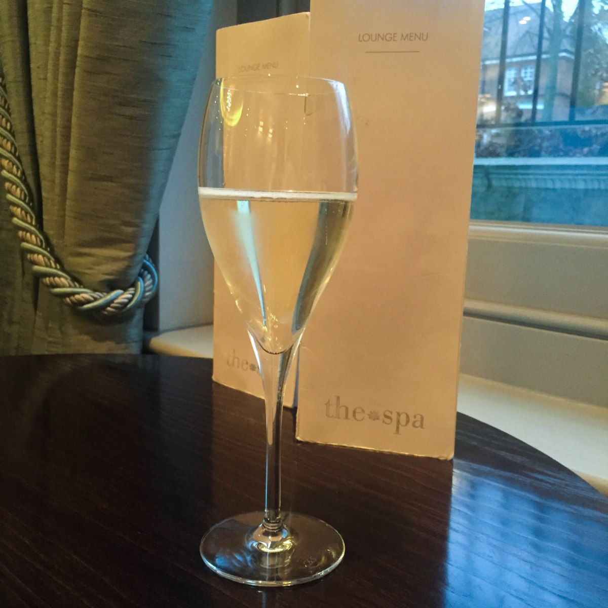 A photograph of a glass of Prosecco that Emma had while waiting for her husband