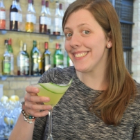 A photograph of Emma's friend holding her finished Cucumber Martini