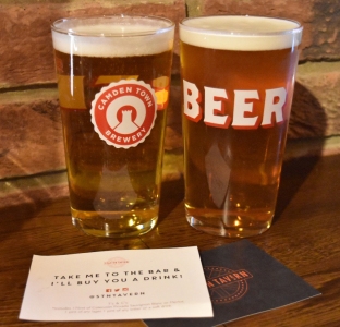 A photograph of two pints: Camden Pale Ale and Camden Hells. In front of these lay two drinks tokens given to Emma and Rob