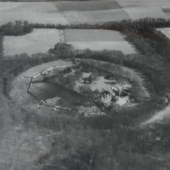 A black and white photograph showing the circular Wandlebury hillfort enclosure.