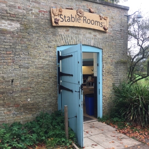 A photograph of the blue entrance door to the education centre at Wandlebury; formerly the stable rooms.